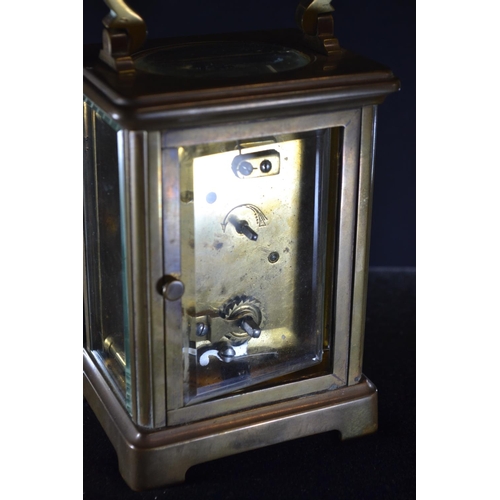 488 - A late 19th/early 20th century brass and bevelled glass cased carriage clock by Benetfink & Co L... 