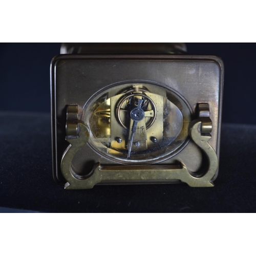 488 - A late 19th/early 20th century brass and bevelled glass cased carriage clock by Benetfink & Co L... 