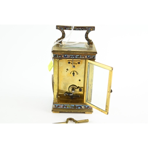 489 - An early C20th French brass carriage clock, case inset with champleve enamel, and with bevel edged g... 