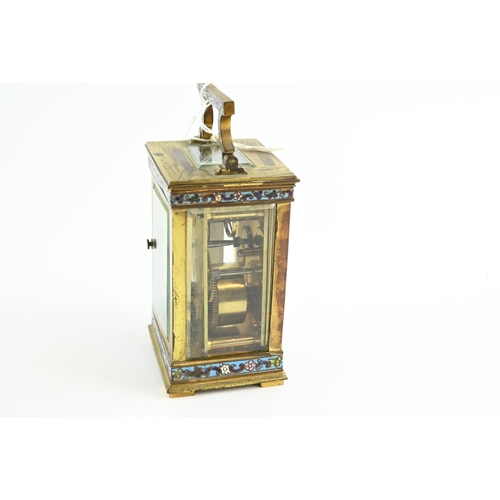 489 - An early C20th French brass carriage clock, case inset with champleve enamel, and with bevel edged g... 