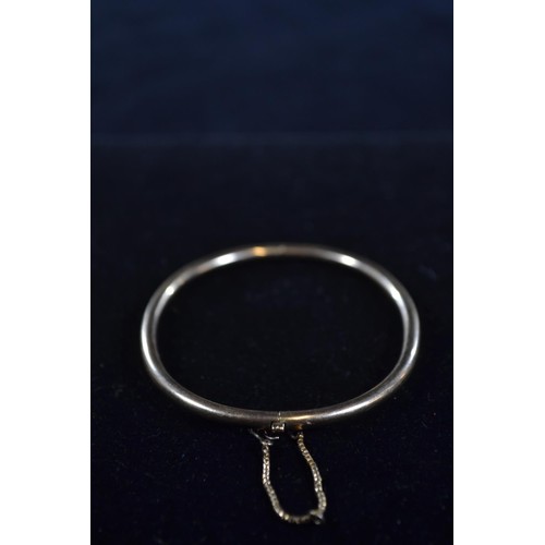 200 - Yellow metal solid bangle (testing positive for 9ct gold) gross weight 9.7g