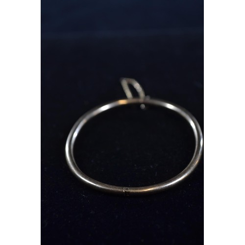 200 - Yellow metal solid bangle (testing positive for 9ct gold) gross weight 9.7g