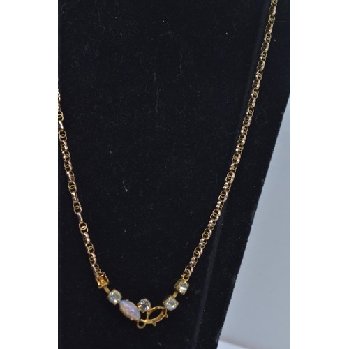 212 - 9ct gold neck chain with later added gilt metal stone set front section, gross weight 5.55 grams, tw... 