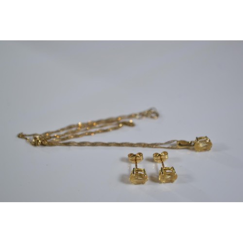 247 - 18ct gold and citrine pendant and earring set on a 9ct gold chain. Gross weight 2.50g