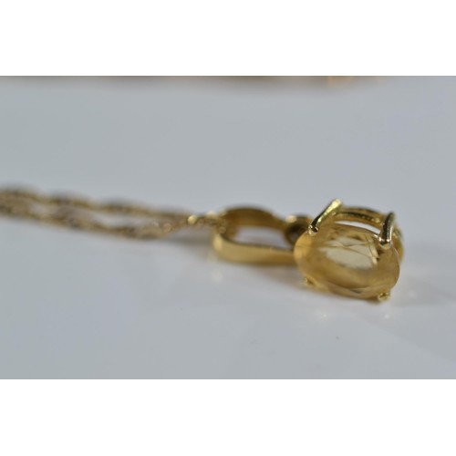 247 - 18ct gold and citrine pendant and earring set on a 9ct gold chain. Gross weight 2.50g