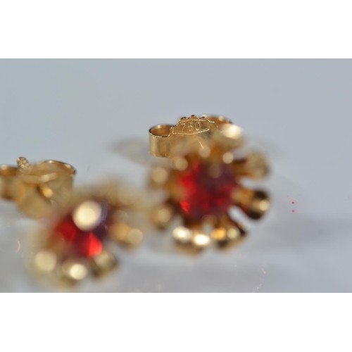 254 - Pair of 18ct gold earrings set with red stones (2g) and 9ct pendant set with seed pearls and white s... 