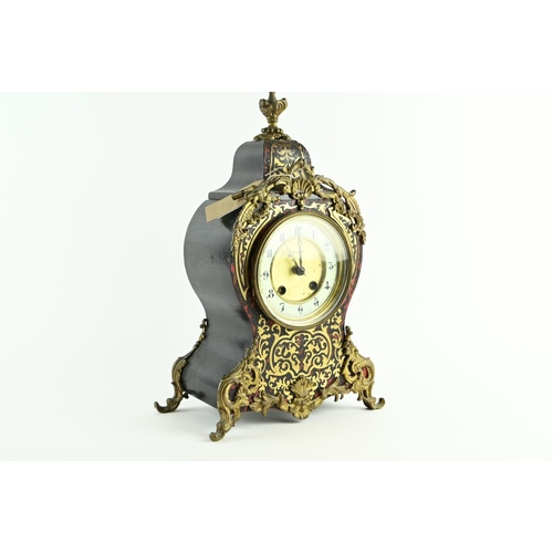 555 - Ornate French Brevete clock with enamelled dial, diameter 12 cms, with key.Ht 36 cms, widest point 2... 