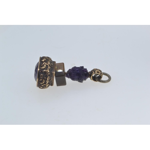 264 - Georgian yellow metal fob set with amethyst backed with agate and a carved amethyst bead. Gross weig... 