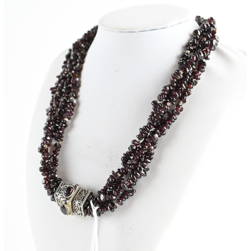 267 - Bohemian style 4 strand garnet bead necklace with white metal spacers and clasp. Approx 440mm circum... 