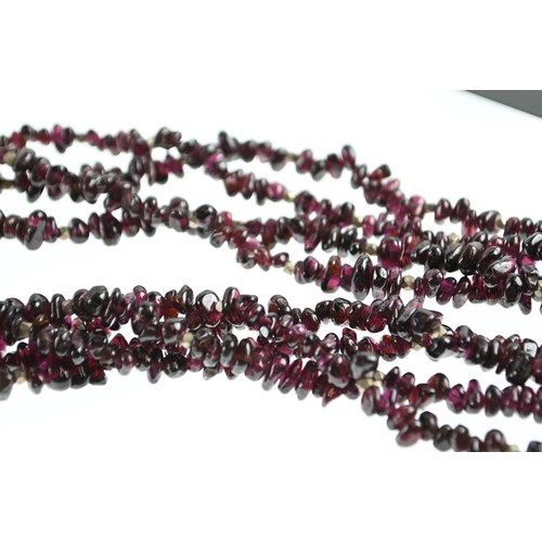 267 - Bohemian style 4 strand garnet bead necklace with white metal spacers and clasp. Approx 440mm circum... 