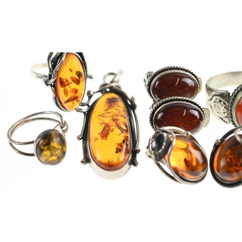 269 - Six pieces of Amber inc, two rings, pendant, two pairs of clip on earrings.