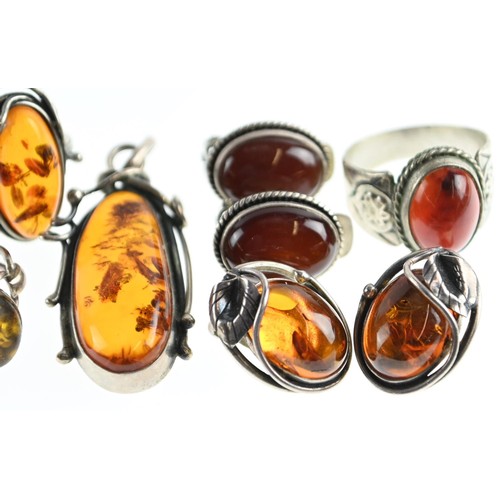 269 - Six pieces of Amber inc, two rings, pendant, two pairs of clip on earrings.