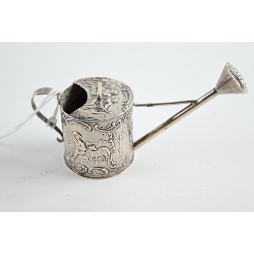 353 - Miniature silver watering can with embossed with figures and scrolling, import marks for London 1900... 