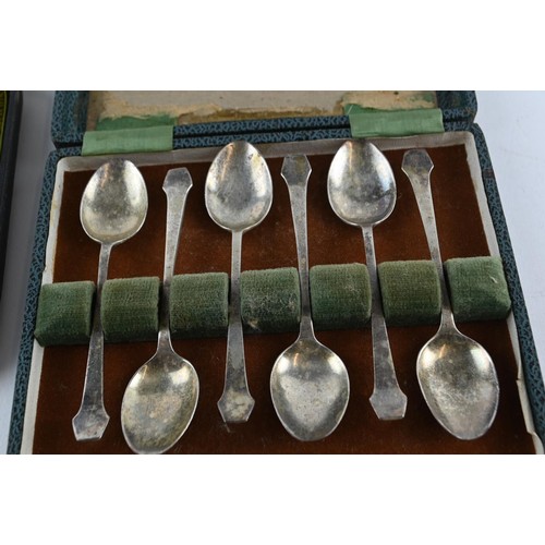 403 - Two cased sets of silver coffee spoons, including: late Victorian set of six spoons with sugar nips ... 