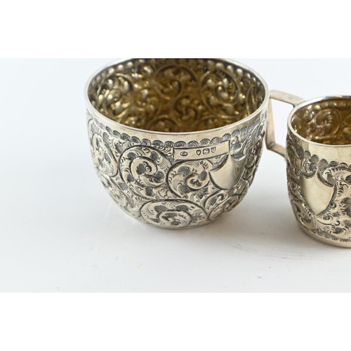 426 - Late Victorian sugar bowl and cream jug, Charles Edwards, London 1891, with embossed decoration and ... 