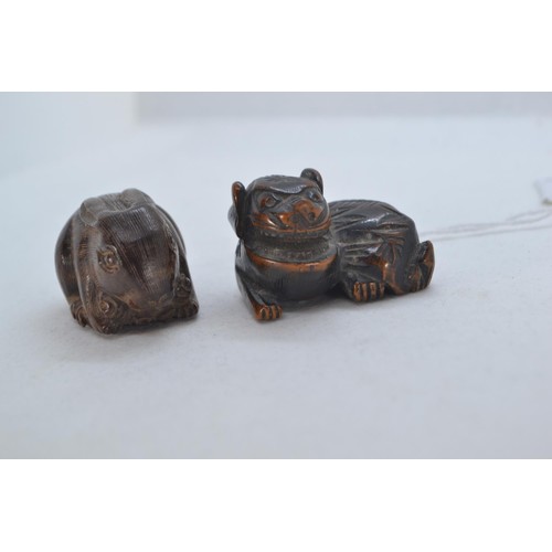 481 - Two Netsuke, including one rabbit and a dragon carved hardwood.