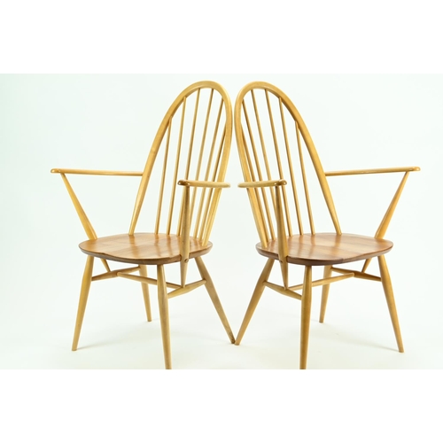 686 - Pair of Ercol 365A Quaker armchairs. Natural finish, with original seat pads.