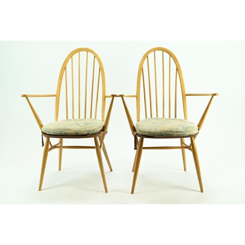 686 - Pair of Ercol 365A Quaker armchairs. Natural finish, with original seat pads.