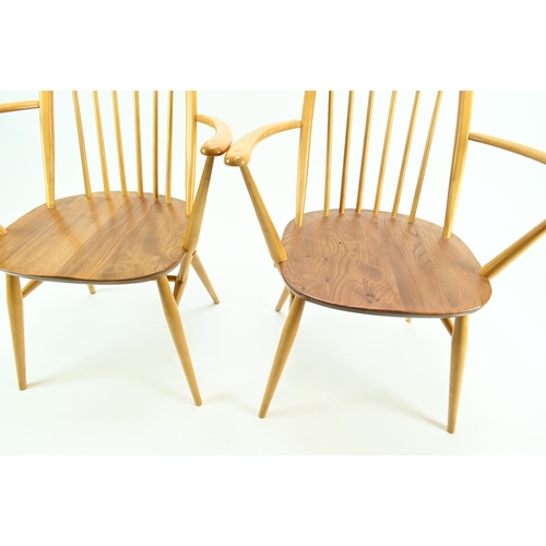 687 - Pair of Ercol 365A Quaker armchairs. Natural finish, with original seat pads.