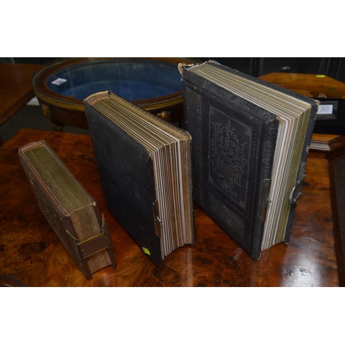 503 - Three late Victorian to Edwardian and possibly later photograph albums, including two leather bound ... 