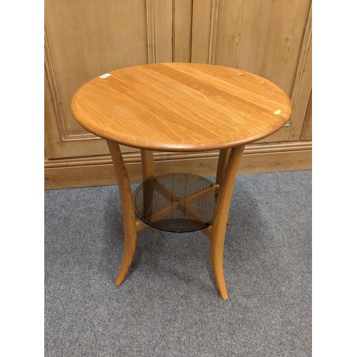 684 - Ercol  circular occasional table 1062 DMW22113 with glazed lower shelf D60cm H63cm