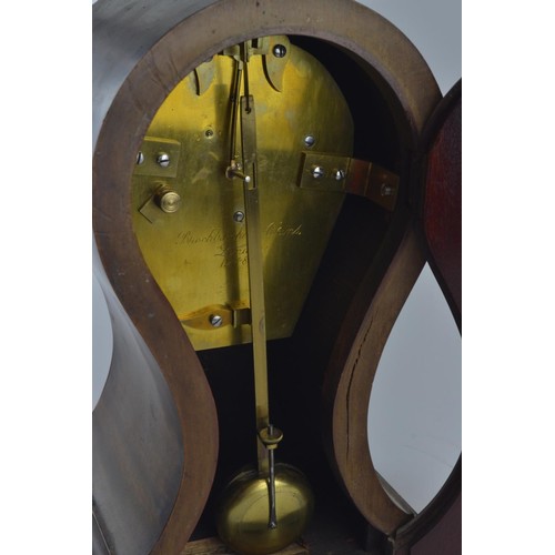 549 - Brockbank & Atkins London mantle clock, numbered 12489, with pendulum, hardwood with tulip-shape... 