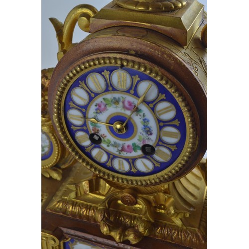 554 - Large ornate heavily gilded mantel clock with painted porcelain panels and face, marked PH Morey to ... 