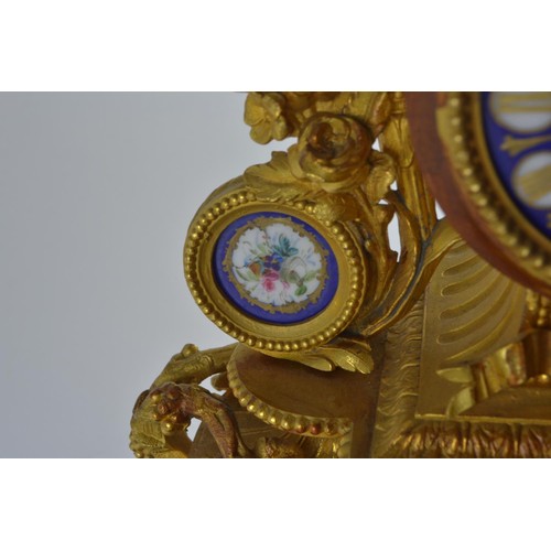 554 - Large ornate heavily gilded mantel clock with painted porcelain panels and face, marked PH Morey to ... 