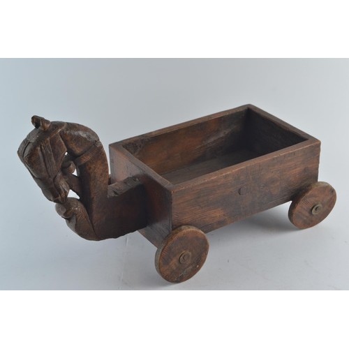 568 - A child's handmade rustic cart with a decorative Tang horse style head, a mahogany drawer 'cart' and... 