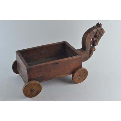 568 - A child's handmade rustic cart with a decorative Tang horse style head, a mahogany drawer 'cart' and... 