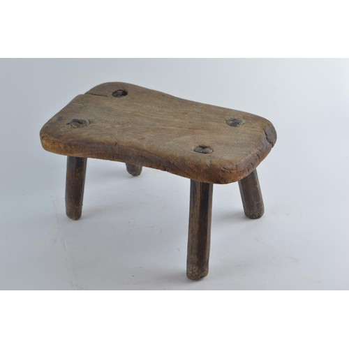 569 - Small rectangle four legged milking stool in hardwood, W30 D28 H16cm