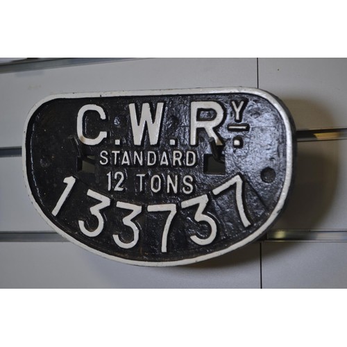 571 - Two cast iron D-shaped train wagon plates, including 'LMS standard 20 tons 750691' and 'G.W.Ry. stan... 