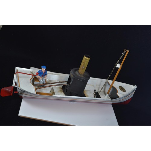 575 - Toucher Walther African Queen model steam boat with original model skipper. L37 H18