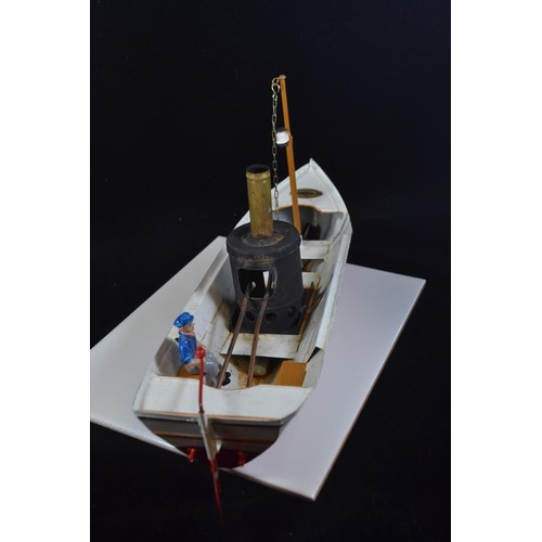 575 - Toucher Walther African Queen model steam boat with original model skipper. L37 H18