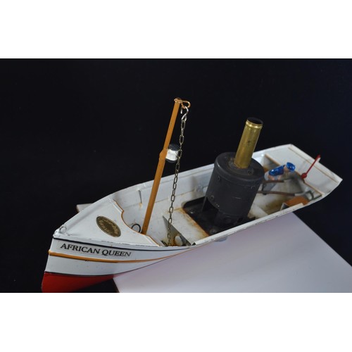 575 - Toucher Walther African Queen model steam boat with original model skipper. L37 H18