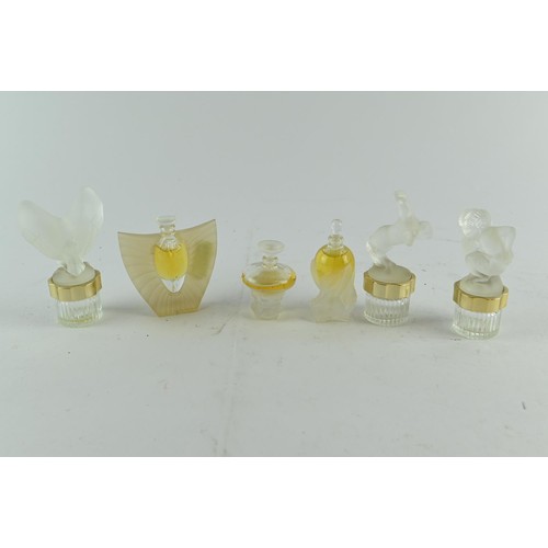 601 - Six Lalique miniature scent bottles, some with contents, one glass