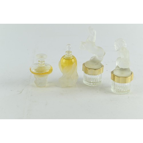 601 - Six Lalique miniature scent bottles, some with contents, one glass