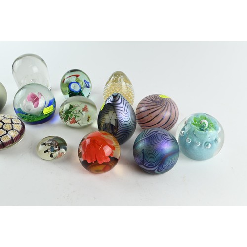 605A - A collection of  fourteen paperweights inc. iridescent, millefiori, captive bubble with some si... 