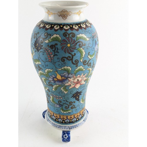 559 - A three footed Japanese porcelain cloisonné style vase decorated with floral motifs on a turquoise g... 