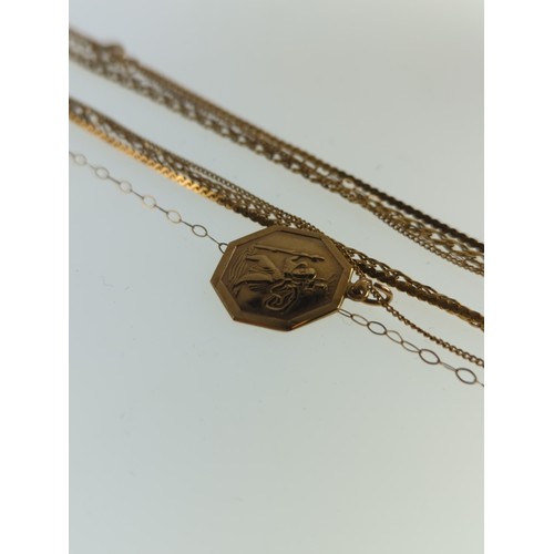 184 - Three 9ct gold neck chains and a 9ct gold St Christopher pendant, together with a yellow metal chain... 