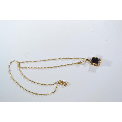 241A - 14ct gold chain with 14ct gold garnet set pendant. Chain circumference 470mm. Gross weight 3.24g