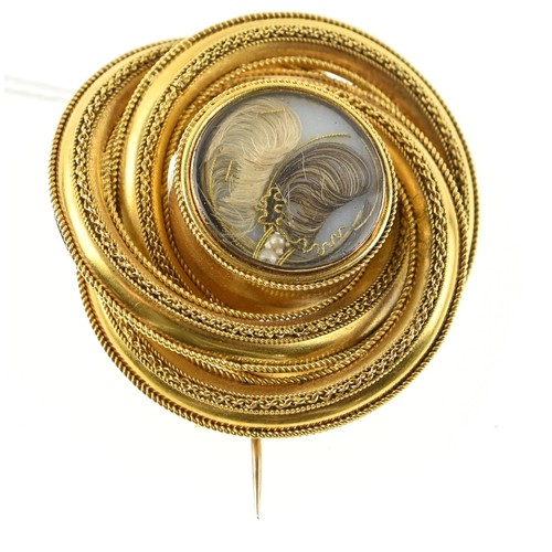 134 - Large yellow metal (testing positive of 18ct gold) mourning brooch in central glass, diameter 45mm. ... 