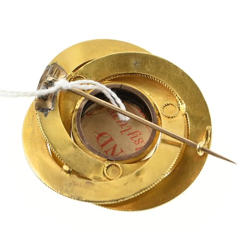 134 - Large yellow metal (testing positive of 18ct gold) mourning brooch in central glass, diameter 45mm. ... 