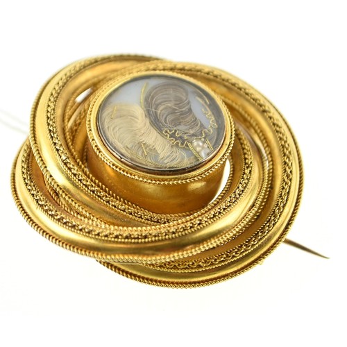 134 - Large yellow metal (testing positive of 18ct gold) mourning brooch in central glass, diameter 45mm. ... 