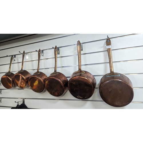 504 - Set of six copper saucepans, largest diameter of pan 23cm, smallest diameter of pan 18cm