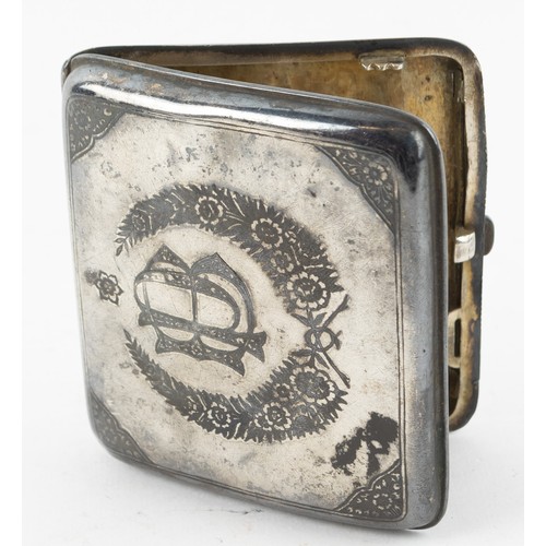 303 - Iraqi white metal and niello cigarette case, the cover decorated with a harbour scene, the base with... 