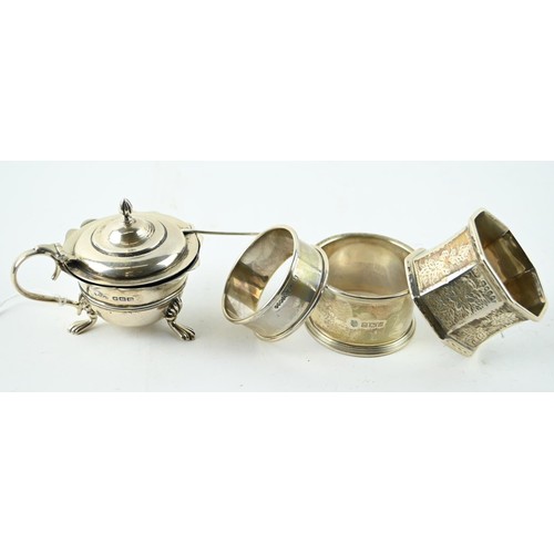 327A - Victorian silver glass lined mustard pot with spoon and three silver napkin rings, various maker's a... 