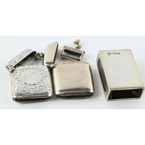 331A - Two silver vestas, Birmingham 1899 and 1903 respectively, a silver matchbox cover, Chester 1901, and... 