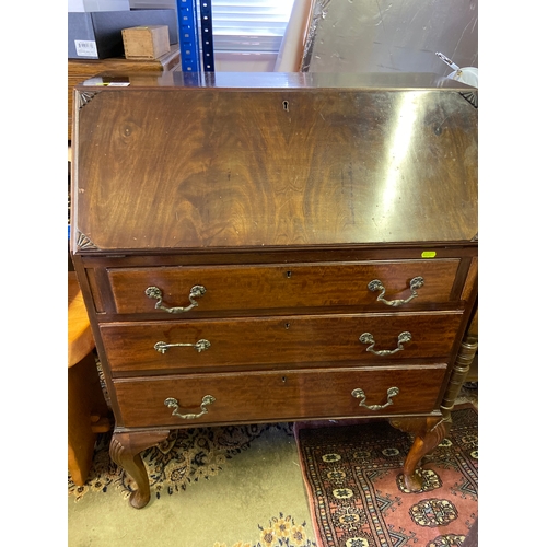 392 - Vintage writing bureau with original leather writing area, Three drawers and locking drop down front... 