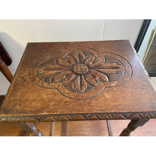 397 - Oak carved top occasional table. W51 D 40 H72.5 cm